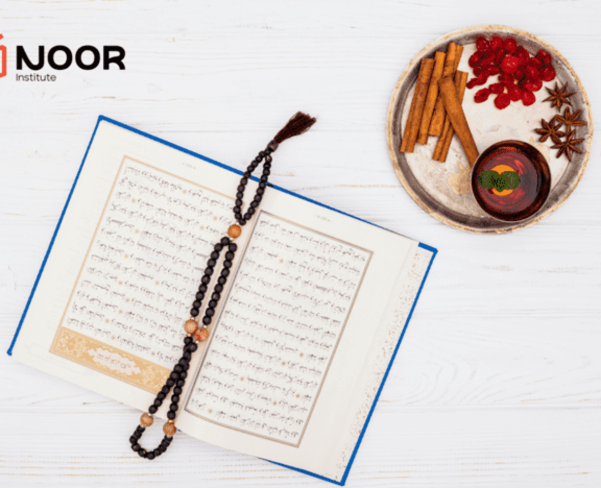 An open Quran with a prayer beads on top