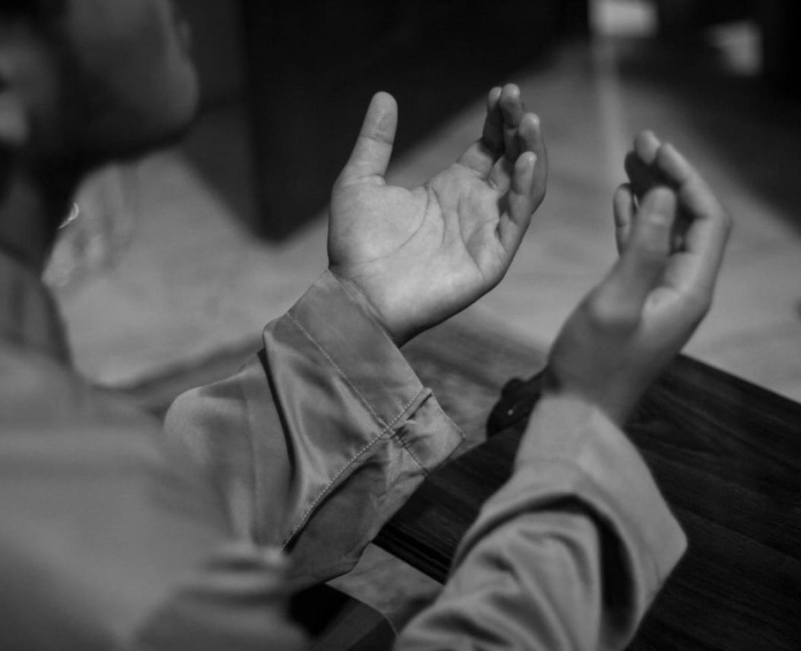 Muslim man praying to Allah